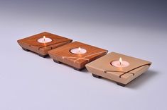 three tea lights sitting on top of each other