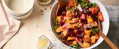 a salad with beets, carrots and nuts in a bowl