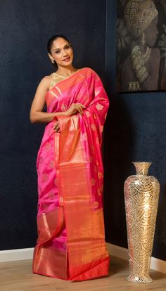 Elevate any occasion with this exquisite pink silk saree, embellished with golden floral embroidery. Perfect for weddings, it promises a comfortable and unforgettable experience. Pink Tissue Silk Saree With Dori Work, Pink Silk Traditional Wear With Dori Work, Silk Traditional Wear With Dori Work In Pink, Pink Traditional Saree With Dori Work, Elegant Pink Saree With Dori Work, Pink Chanderi Saree For Wedding, Pink Tissue Silk Saree With Traditional Drape, Designer Pink Saree With Zari Work, Pink Chanderi Designer Traditional Wear