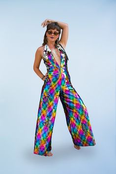 Rainbow sequin jumpsuit.   Dress to impress! The perfect festival outfit, hen weekend, party piece to make sure you stand out from the crowd. Beautifully hand made with lining, neck and back tie to ensure a comfortable fit. Stunning handmade jumpsuit in top quality rainbow and silver reversible sequins. Expert workmanship and quality material make this a show stopper of a piece. We will custom make these as you order, so please leave a note with your measurements. We are now posting with DHL Exp 70s Jumpsuits For Women, Sequins Jumpsuit, Hslot Outfit Ideas, Disco Jumpsuit, Loose Romper, Hen Weekend, Tie Dye Jumpsuit, Disco Pants, Jumpsuit For Women