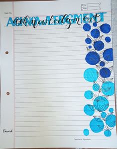 a piece of paper with blue flowers on it and the word assignment written in black ink