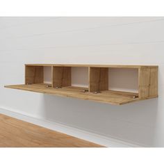 a wooden shelf with three compartments on the wall