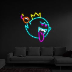 a living room with a couch and a neon light wall sticker on the wall