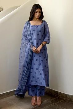 Blue handwoven kurta with floral, polka dot printed motifs and scoop-neck. Paired with printed pant and tribal bordered chiffon dupatta.
Component: 3
Printed
Neckline: Scoop neck
Sleeve Length: Three quarter
Fabric: Kurta and Pant: Handwoven Chanderi Silk, Dupatta: Chiffon 
Color: Blue
Polka dot print
Printed dupatta
Back scoop-neck - Aza Fashions Chiffon Kurta, Block Printed Kurta, Urban Chic Outfits, Kurta Set With Dupatta, Cotton Suit Designs, Chanderi Silk Suits, A Line Kurti, Trendy Outfits Indian, Blue Kurta