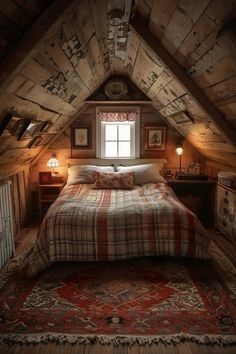 an attic bedroom with a bed and rug