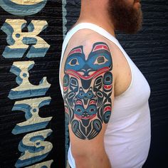 a man with a tattoo on his arm