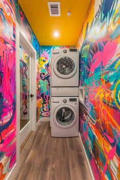 a washer and dryer in a brightly painted hallway