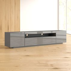 a modern tv stand in an empty room