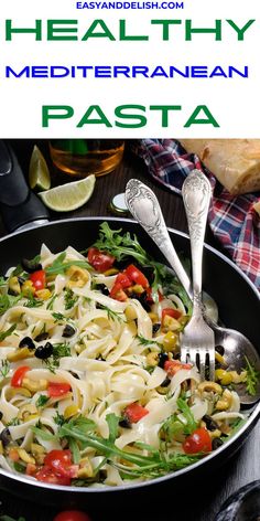 a skillet filled with pasta and vegetables