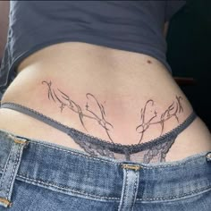 a woman's stomach with birds on it