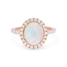 Timeless and romantic, this ring features a 1.70 carat oval cut opal accented by a halo of round brilliant cut diamonds totaling 0.60 carats. Classic Opal Ring With Diamond Accents, Classic Oval Opal Ring With Diamond Accents, Opal Rings With Diamond Accents, Oval Shaped, Oval Opal Rings With Diamond Accents, Oval Opal Ring With Diamond Center Stone, Oval Diamond Opal Ring With Center Stone, Luxury Oval Opal Ring With Halo Setting, White Opal Ring With Oval Halo Setting, White Oval Opal Ring With Halo Setting