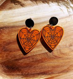 Orange heart drop earrings, handmade in resin and with a spiderweb design which has been hand painted in black. They are hung from flat black stud tops and have a drop of 65mm. These heart shaped drops are the perfect accessories for the upcoming Halloween season and will finish off your fancy dress costume beautifully.  They are lightweight to wear and will make spooktacular gifts for lovers of gothic style. Please get in touch if you'd like these in a different colour combination, all ideas we Trick Or Treat Costume, New Business Ideas, Gothic Gifts, Black Stud, Halloween Orange, Heart Drop Earrings, Fancy Dress Costumes, Spider Web, Resin Jewelry