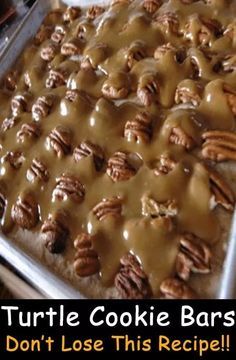 a baking pan filled with pecans covered in gravy