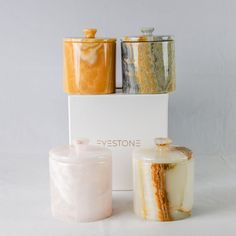 three different types of jars sitting next to each other