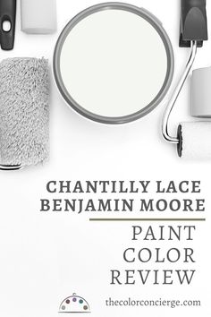 a white bathroom with black accents and the words, chantilly lace benjam moore paint color review