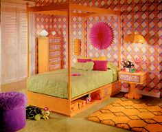 a bedroom decorated in pink, yellow and green with a four poster bed surrounded by colorful rugs