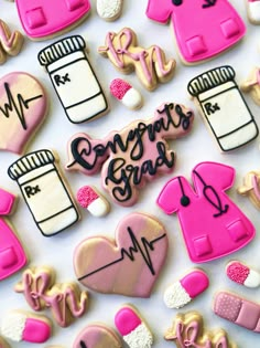 decorated cookies with the words congrats grad and doctor's stethoscope