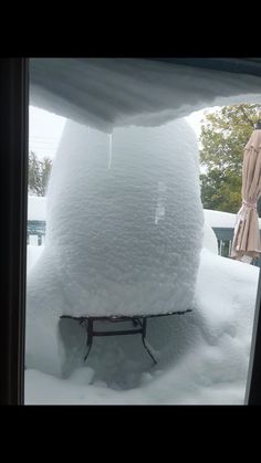 the snow is piled on top of the table