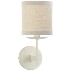 a white wall light with a beige shade on the side and a round shaped lamp