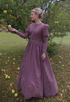 This charming dress has a jewel neckline, front button closure and leg-o-mutton long sleeves. The fitted bodice has a full skirt gathered at the waist. This dress also features our three-paneled full skirt with pockets. Hand wash or machine wash and dry gently. 100% sturdy cotton. The model is wearing boots and a crinoline, which are priced separately. Designed and made proudly by Recollections in America! The following are approximate finished measurements and include room for ease of movement. Prairie Dresses Carolyn Ingals, Long Sleeve Dress With Fitted Bodice, Fall Dresses With Gathered Skirt, Long Sleeve Dress With Gathered Skirt, Modest Long Sleeve Dress For Garden Party, Long Sleeve Dresses With Gathered Sleeves For Garden Party, Long Sleeve Gathered Skirt Fall Dress, Long Sleeve Dress With Gathered Skirt For Fall, Classic Bishop Sleeve Dresses