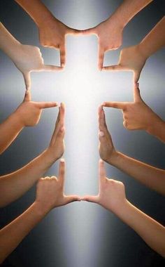 several hands reaching up towards the cross with their thumbs pointing upwards in front of them