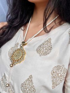 Kalima Shahadat engraved in a kundan pendant with a beautiful pearl beaded chain. Care instructions: Please keep away from perfume, water and harsh chemicals. To clean please just wipe with a clean dry fibre cloth. No return, no exchange. Diwali Chandbali Pearl Necklace With Intricate Design, Bollywood Style Intricate Pearl Necklace For Diwali, Diwali Pearl Pendant Necklace, Traditional Pearl Drop Pendant Necklace, Intricate Design Pearl Necklace For Diwali, Intricate Pearl Necklace For Diwali, Intricate Design Pearl Necklace As Festival Gift, Festive Pearl Necklace With Intricate Design For Diwali, Festive Pearl Necklace With Intricate Design As Gift