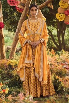 Mustard yellow anarkali with floral printed motifs and subtle embroidery spread. Paired with short front open jacket with bandhani prints, yoke and sleeves embroidered. Comes with a silk organza dupatta.
Component: 3
Printed, Embroidered
Neckline: Anarkali: Round, Jacket: V-Neck
Fabric: Anarkali and Jacket: Silk Chanderi, Dupatta: Silk Organza
Color: Yellow
Floral printed anarkali
Bandhani printed jacket
Front tassel tie-up jacket
Tassel edged dupatta
Marodi embroidery - Aza Fashions Mustard Anarkali, Marodi Work, Embroidery Anarkali, Punit Balana, Yellow Anarkali, Printed Anarkali, Organza Dupatta, Embroidered Neckline, Indian Fashion Designers