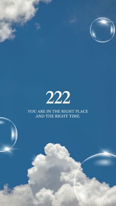 the sky is filled with bubbles that say, 223 you are in the right place and the right time