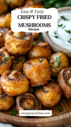 crispy fried mushrooms on a wooden platter with ranch dip and parsley in the background