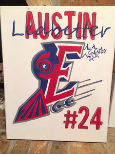 a white sign with red and blue lettering on it that says, laustin ez