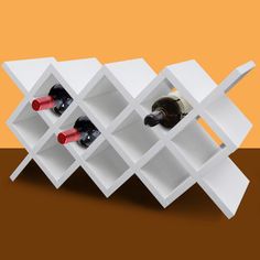 a white wine rack with six bottles in it on a brown table next to an orange wall