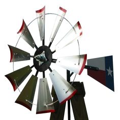 an old fashioned windmill with texas flag on it