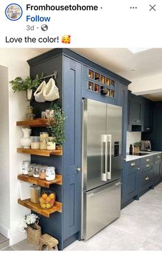 a kitchen with blue cabinets and shelving in the middle is featured on instagram