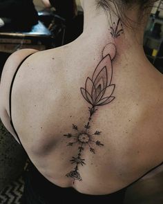 a woman with a tattoo on her back