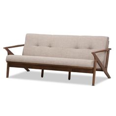 a wooden frame couch with beige fabric on the back and arm rests against a white background