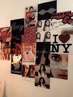 the wall is covered with many different pictures and words, including women's faces