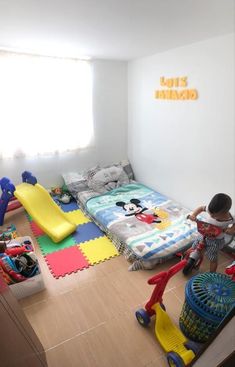 a child playing with toys in his bedroom