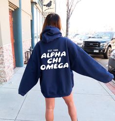 Soft, cute, and trendy, this Alpha Chi Omega hoodie will quickly become your go-to cozy sweatshirt! Use the drop down to specify preference between carolina blue, navy, royal blue, pink, chocolate, or red. LISTING IS FOR ALPHA CHI OMEGA. Please be sure you are ordering for your correct Sorority.  We print on high quality, soft, & heavyweight materials, sustainably made and printed in the US. ♥ SIZING ♥ Unisex Sizing- For a more feminine, fitted look we recommend getting your size. For a more ove Winter School Spirit Hoodie With Letter Print, Letter Print Hoodie Sweatshirt For Campus, Campus Hoodie Sweatshirt With Letter Print, Hooded Hoodie With Letter Print For Campus, Oversized Collegiate Hoodie With Letter Print, Oversized Collegiate Hoodie For College, Varsity Letter Print Hoodie For Campus, Big Little Gifts, Alpha Chi Omega