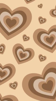 many hearts are arranged in the shape of heart shapes on a beige and brown background