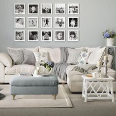 a living room filled with furniture and pictures on the wall above it's coffee table