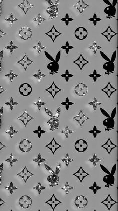 black and white photograph of many different designs on a sheet of foiled paper with silver sequins