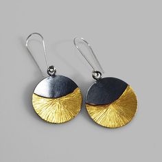 A stunning pair of earrings that hold a beautiful shine and transition from day to night with ease. Made of sterling silver, 14k gold keum boo and finished with a dark patina. Measure: about 2 inches down. Arrives to you in a gift box with foam padding and tissue paper. This item is a special made to order piece. Please allow me at least one week to complete your piece before it is shipped. If you need this item right away or shipped to a different location please contact me. Sterling Silver Dual-tone Earrings For Gift, Gold Oxidized Round Earrings, Gold Round Earrings With Oxidized Finish, Hand Forged Black Earrings For A Gift, Hand Forged Black Earrings As A Gift, Gold Oxidized Earrings For Gift, Gold Oxidized Finish Earrings For Gift, Dual-tone Round Earrings For Gift, Keumboo Jewelry