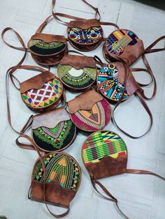 This is a set of complete 10 tote leather bags. They are totally made of fabric and leather and comes in different colours, size and designs.Place your orders for this amazing deal as for both retail and wholesale Oromo Jewelry, Kitenge Bags, Fancy Handbags, Ankara Bags, African Bag, African Crafts, African Accessories, Diy Leather Bag, Sling Bags