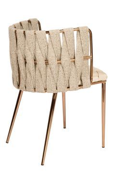 a beige chair with gold metal legs