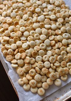 a bunch of food that is sitting on a table in the middle of some paper