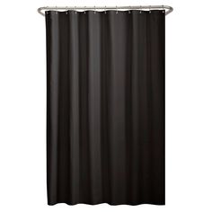 a black shower curtain hanging on the side of a wall