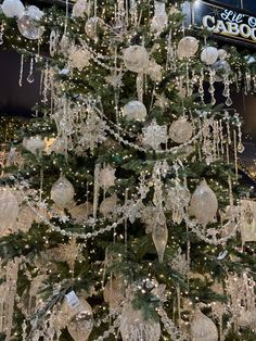 a christmas tree with ornaments hanging from it