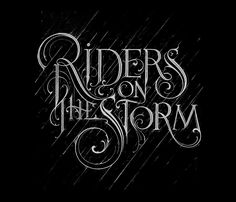 the words riders on the storm are drawn in white ink, and it appears to be raining