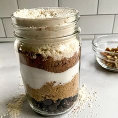 a glass jar filled with food sitting on top of a counter