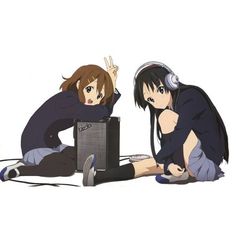 two anime characters sitting on the ground with headphones in their ears and one holding a laptop